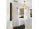 Hallway features a decorative light fixture, a window with blinds, and textured walls at 719 21St N Ave, St Petersburg, FL 33704