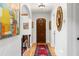 Bright hallway with hardwood floors, arched doorway, and decorative mirror at 719 21St N Ave, St Petersburg, FL 33704