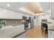 Open kitchen featuring stainless steel appliances, light colored cabinets, and breakfast bar seating at 719 21St N Ave, St Petersburg, FL 33704