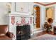 Cozy living room featuring fireplace with detailed mantel and classic interior design elements at 719 21St N Ave, St Petersburg, FL 33704