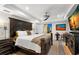 Spacious main bedroom featuring dark furniture and decorative artwork on the walls at 719 21St N Ave, St Petersburg, FL 33704