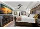 Cozy main bedroom featuring dark furniture, a ceiling fan, and neutral tones at 719 21St N Ave, St Petersburg, FL 33704