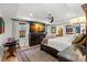 Bright main bedroom featuring a large tv, a ceiling fan, and neutral tones at 719 21St N Ave, St Petersburg, FL 33704