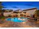 Relaxing backyard pool with a stone patio, lounge chairs, and an outdoor seating area at 719 21St N Ave, St Petersburg, FL 33704