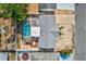 A bird's eye view shows a pool and xeriscaped front yard in a suburban neighborhood at 7635 Sue Ellen Dr, Port Richey, FL 34668