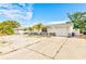 Street view of a well-kept, single-story home with an attached garage, featuring a low maintenance front yard at 7635 Sue Ellen Dr, Port Richey, FL 34668