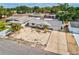 This is an aerial shot of the front yard of a house with xeriscaping and palm trees at 7635 Sue Ellen Dr, Port Richey, FL 34668