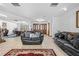 Cozy living room with tile flooring, comfortable seating, and an inviting atmosphere for gatherings at 7948 Floral Dr, Weeki Wachee, FL 34607