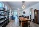 Stylish dining area with a unique wood table and decorative light fixtures at 811 Winterside Dr, Apollo Beach, FL 33572