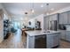 Modern kitchen with gray cabinets, stainless steel appliances, and an open layout at 811 Winterside Dr, Apollo Beach, FL 33572