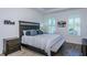 Bright main bedroom with plantation shutters, neutral colors, and tray ceilings for a serene and inviting space at 811 Winterside Dr, Apollo Beach, FL 33572