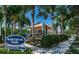 Wolf Creek Park playground shaded by a canvas roof, and mature landscaping at 811 Winterside Dr, Apollo Beach, FL 33572