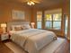 Bright bedroom boasts neutral tones, plush bedding, and large windows, creating a peaceful retreat at 8137 Cottonwood Ct, Seminole, FL 33776