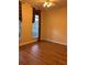 Cozy bedroom with hardwood floors and natural light from the window at 8137 Cottonwood Ct, Seminole, FL 33776