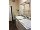 Well-equipped laundry room with washer, dryer, sink, and shelving at 8137 Cottonwood Ct, Seminole, FL 33776