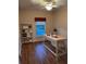 Office showcasing wood floors and a desk with shelf at 8137 Cottonwood Ct, Seminole, FL 33776