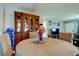 Lovely dining room features a round table with seating for four, and a built-in wooden display cabinet at 8417 Moulton Dr, Port Richey, FL 34668