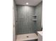 Modern bathroom featuring stylish tiling, built-in shelves, and a new shower at 8480 60Th N St # 801, Pinellas Park, FL 33781