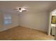 Bedroom with tile floor, ceiling fan, and a bright window bringing in natural light at 8765 Bardmoor Blvd # 107, Seminole, FL 33777