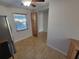 Kitchen dining area features a pantry, natural light, and neutral colors at 8765 Bardmoor Blvd # 107, Seminole, FL 33777