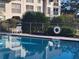 A refreshing pool offers a relaxing outdoor amenity and is situated near condos with balconies at 8765 Bardmoor Blvd # 107, Seminole, FL 33777