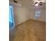 Spare room featuring neutral colored tile flooring, fan, and a single window at 8765 Bardmoor Blvd # 107, Seminole, FL 33777