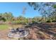 Relaxing pond view with seating area, perfect for enjoying nature at 9250 Rhea Dr, Odessa, FL 33556