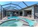 Expansive in-ground pool with an integrated spa, covered patio, and screened-in enclosure with plenty of room at 9250 Rhea Dr, Odessa, FL 33556