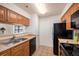 Functional kitchen featuring stainless steel appliances and light wood cabinetry at 1000 W Horatio St # 301, Tampa, FL 33606