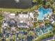 Overhead view showcases community's pool, tennis courts, and meticulous landscaping creating the resort style environment at 1028 Mcdaniel St # 68, Sun City Center, FL 33573