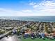 Aerial view of waterfront home with Gulf of Mexico views at 1201 Bay Dr, Belleair Beach, FL 33786