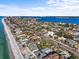 Aerial view of a beach neighborhood and coast at 1201 Bay Dr, Belleair Beach, FL 33786