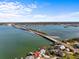 Aerial view of waterfront homes close to bridge at 1201 Bay Dr, Belleair Beach, FL 33786