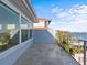 Spacious balcony with scenic waterfront views, offering a perfect spot to enjoy the outdoors and the surrounding scenery at 1201 Bay Dr, Belleair Beach, FL 33786