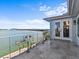 Expansive balcony overlooking the waterfront, providing a serene outdoor space for relaxation and scenic views at 1201 Bay Dr, Belleair Beach, FL 33786