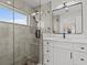 Modern bathroom with walk-in shower, bright natural light, and elegant fixtures at 1201 Bay Dr, Belleair Beach, FL 33786