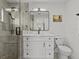 Stylish bathroom featuring a glass shower, quartz countertop vanity, and modern fixtures at 1201 Bay Dr, Belleair Beach, FL 33786