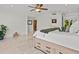 Bright bedroom boasts a ceiling fan, ensuite bathroom, and a walk-in closet, offering a serene retreat at 1201 Bay Dr, Belleair Beach, FL 33786