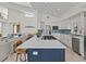 Open-concept kitchen featuring a large island, sleek appliances, custom cabinetry, and modern finishes at 1201 Bay Dr, Belleair Beach, FL 33786