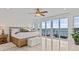Main bedroom boasts a water view and balcony access at 1201 Bay Dr, Belleair Beach, FL 33786