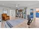 Bright home office with a chair, rug, and an abundance of storage at 1201 Bay Dr, Belleair Beach, FL 33786