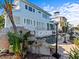 A backyard showcasing a pool, rock waterfall, and beautiful plants surrounding the water feature at 1201 Bay Dr, Belleair Beach, FL 33786