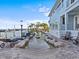 A luxurious outdoor space with a beautiful water feature, lush landscaping, and serene waterfront views and boat dock at 1201 Bay Dr, Belleair Beach, FL 33786