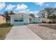 Single-story residence featuring a well-kept front yard and a convenient driveway at 1403 Coppertree Dr, Tarpon Springs, FL 34689