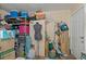 Cluttered storage area with shelves, boxes, and various household items at 1403 Coppertree Dr, Tarpon Springs, FL 34689