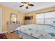 Bright bedroom with a window and decorated with a beach motif at 14130 Rosemary Ln # 3203, Largo, FL 33774