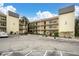 Well-maintained condo building with ample parking and beautiful landscaping at 14130 Rosemary Ln # 3203, Largo, FL 33774