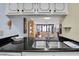 This kitchen features a black countertop and stainless steel sink at 14130 Rosemary Ln # 3203, Largo, FL 33774