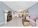 Cozy living room with tile flooring, comfortable seating, and a ceiling fan at 14130 Rosemary Ln # 3203, Largo, FL 33774