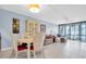 The living room features tile floors, an open floorplan, and neutral paint colors at 14130 Rosemary Ln # 3203, Largo, FL 33774